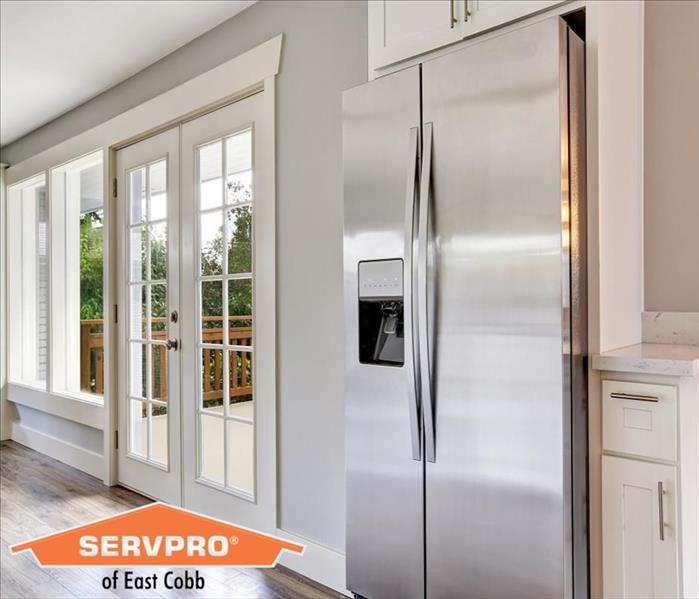 img src =”refrigerator.jpg” alt = "restored property with stainless steel refrigerator” >
